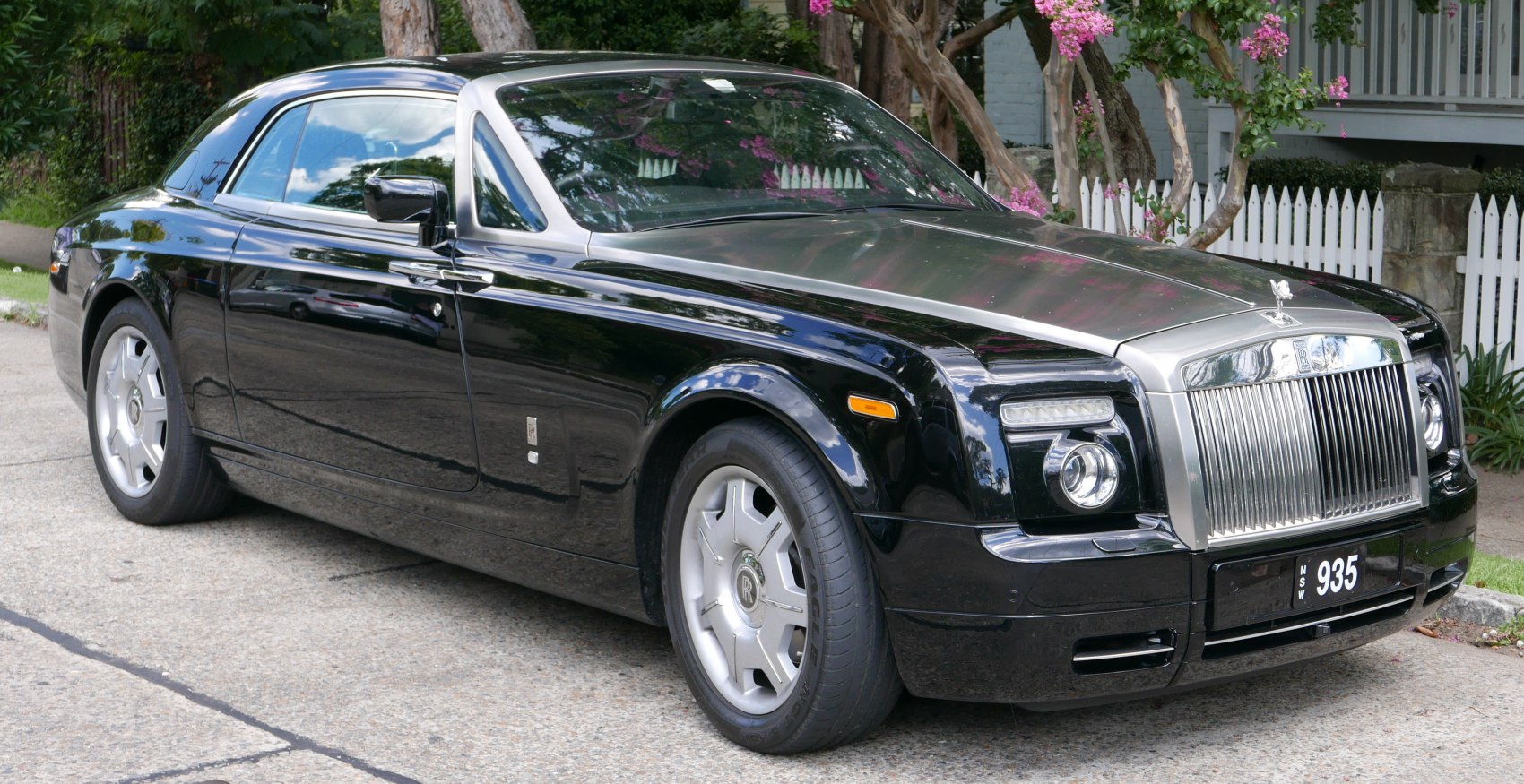 Front view and sleek coupe profile with iconic grille and premium wheels
