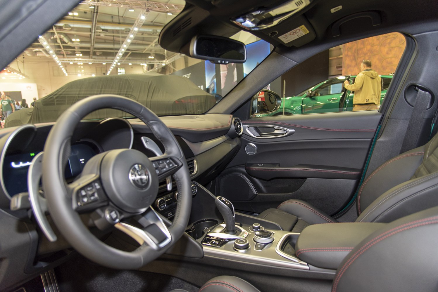 Sporty interior with leather seats, advanced controls, and premium finishes