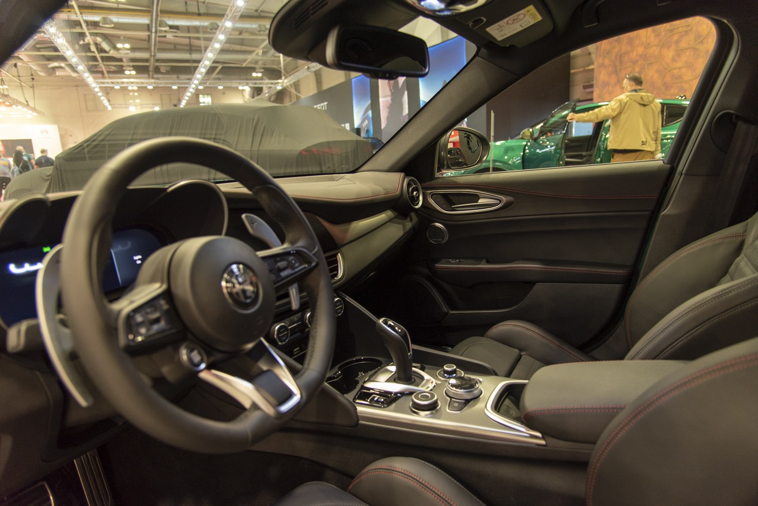 Steering wheel, gear shift, and premium interior with sporty seats