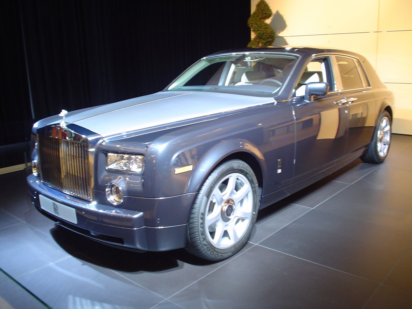 Luxury sedan with a prominent chrome grille and classic round headlights