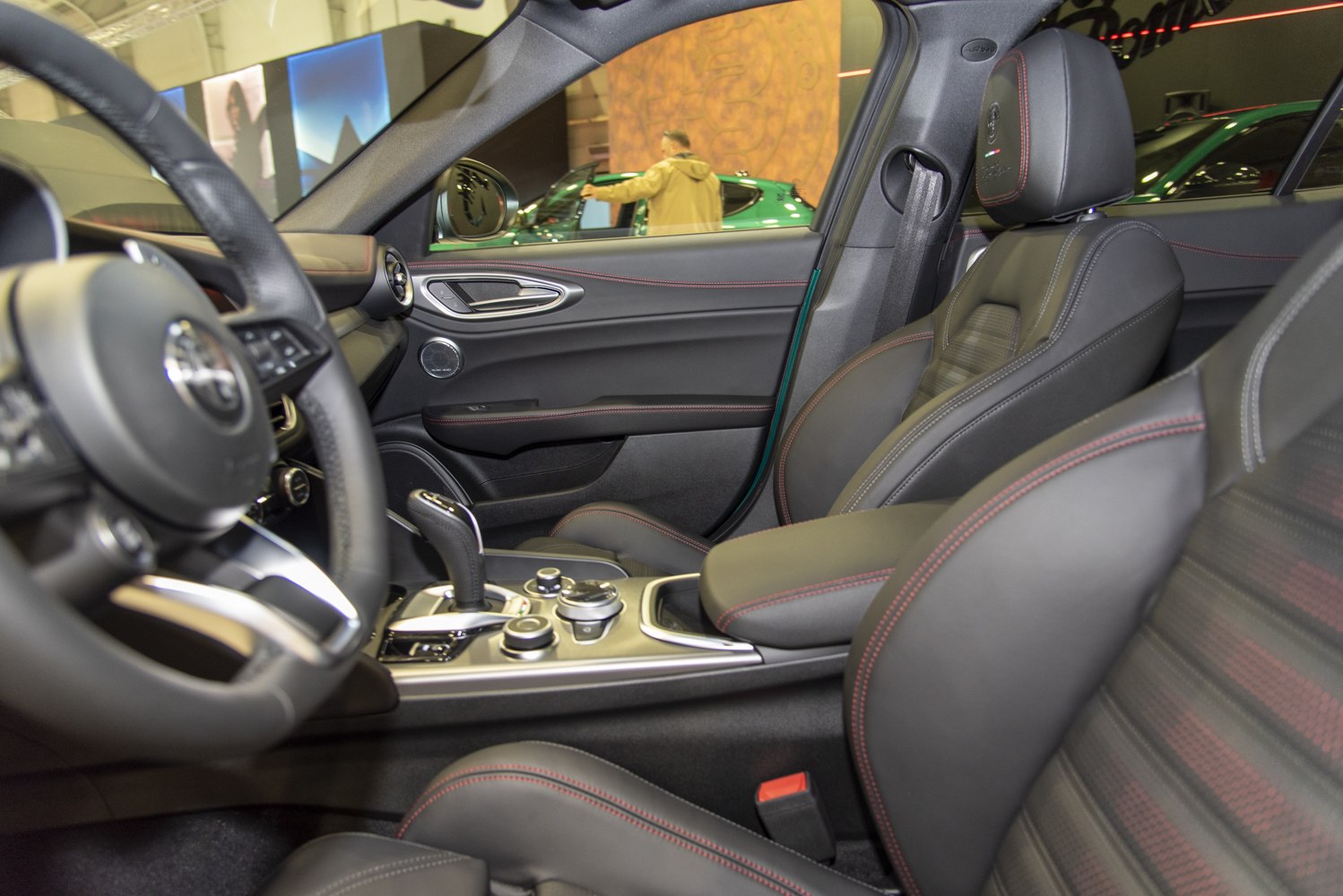 Luxury leather seating with red stitching and advanced center console