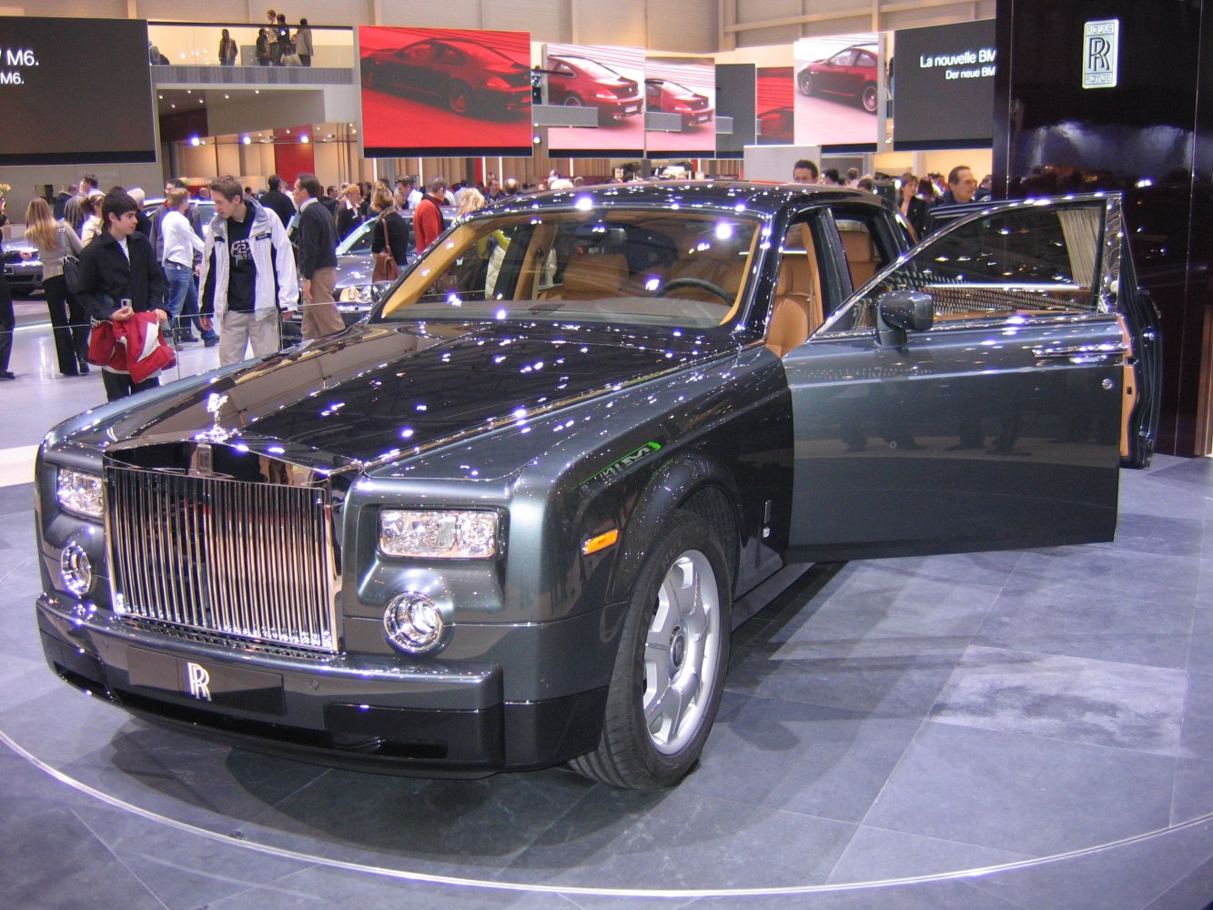 Luxury sedan front with open passenger door