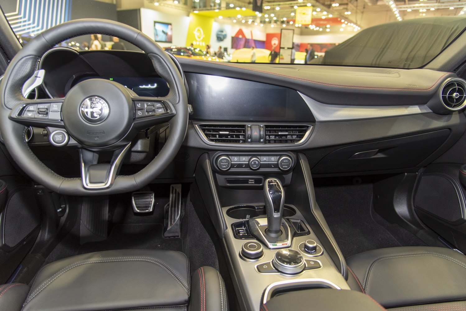 Modern car interior with dashboard, steering wheel, and center console
