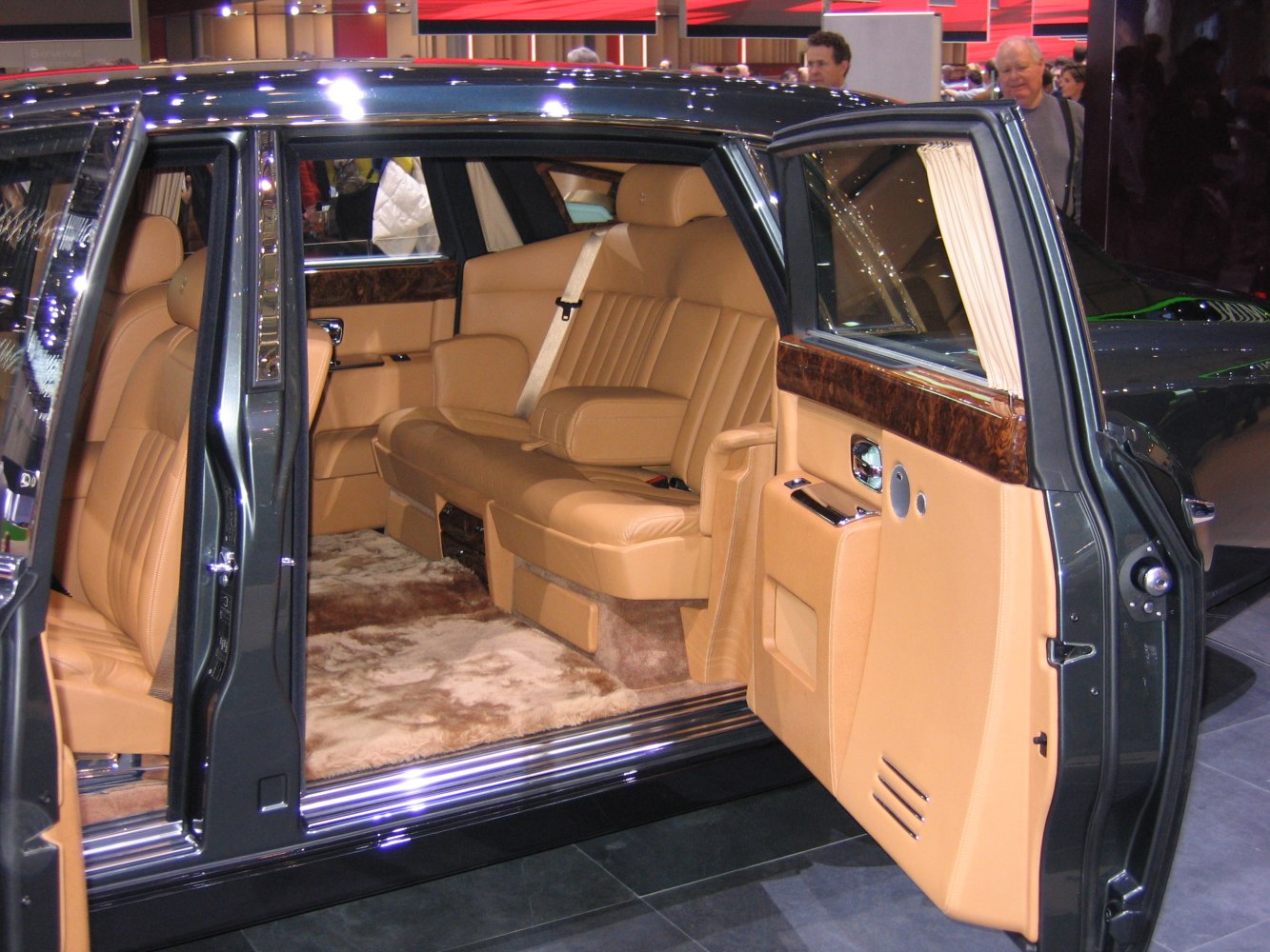 Luxury extended wheelbase sedan interior with tan leather and wood trim