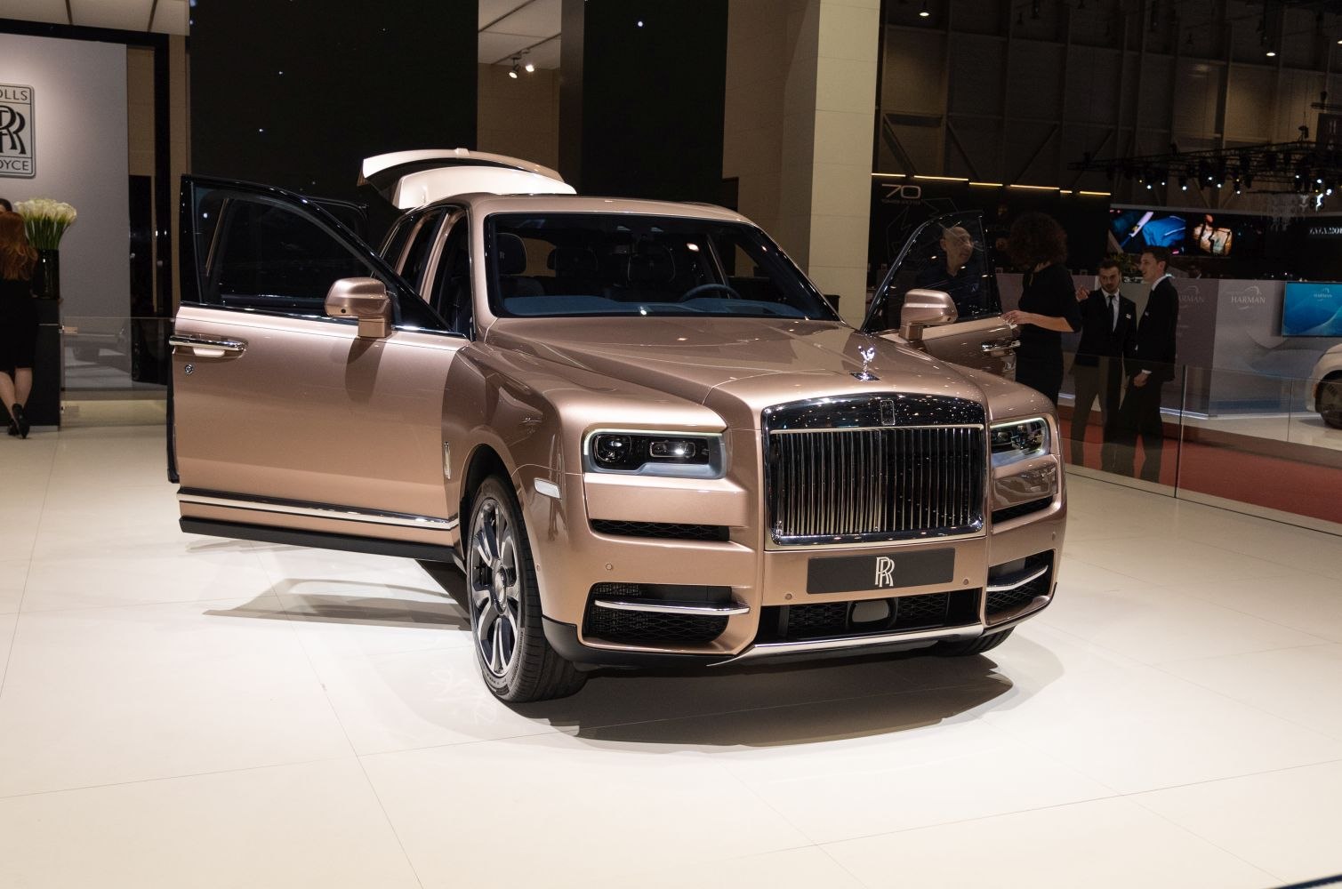 Luxury SUV front view with open front doors and visible grille and headlights