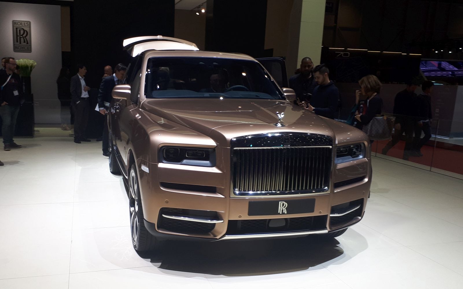 Front view of luxury SUV with large grille and rectangular headlights