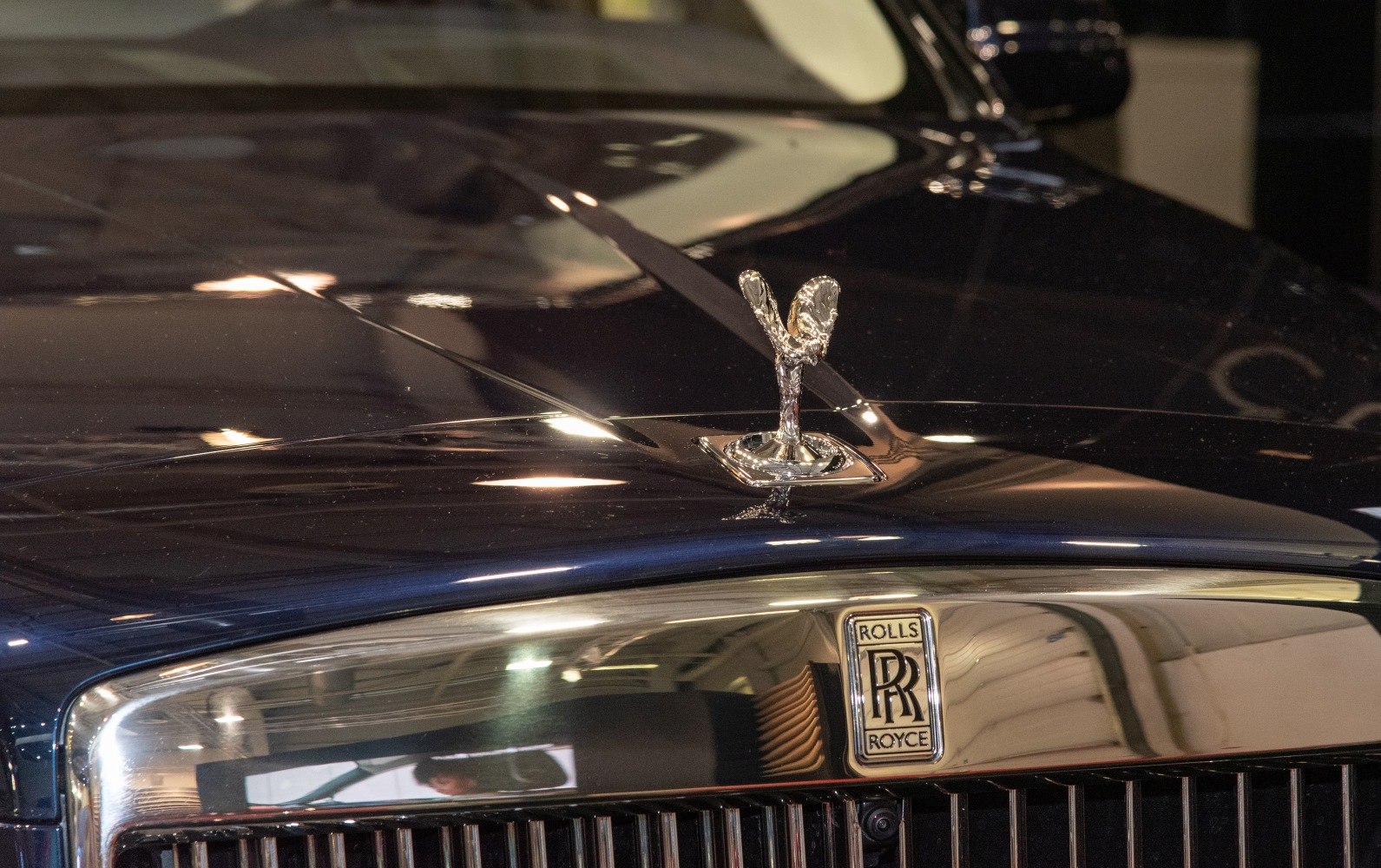 Spirit of Ecstasy hood ornament and chrome front grille close-up