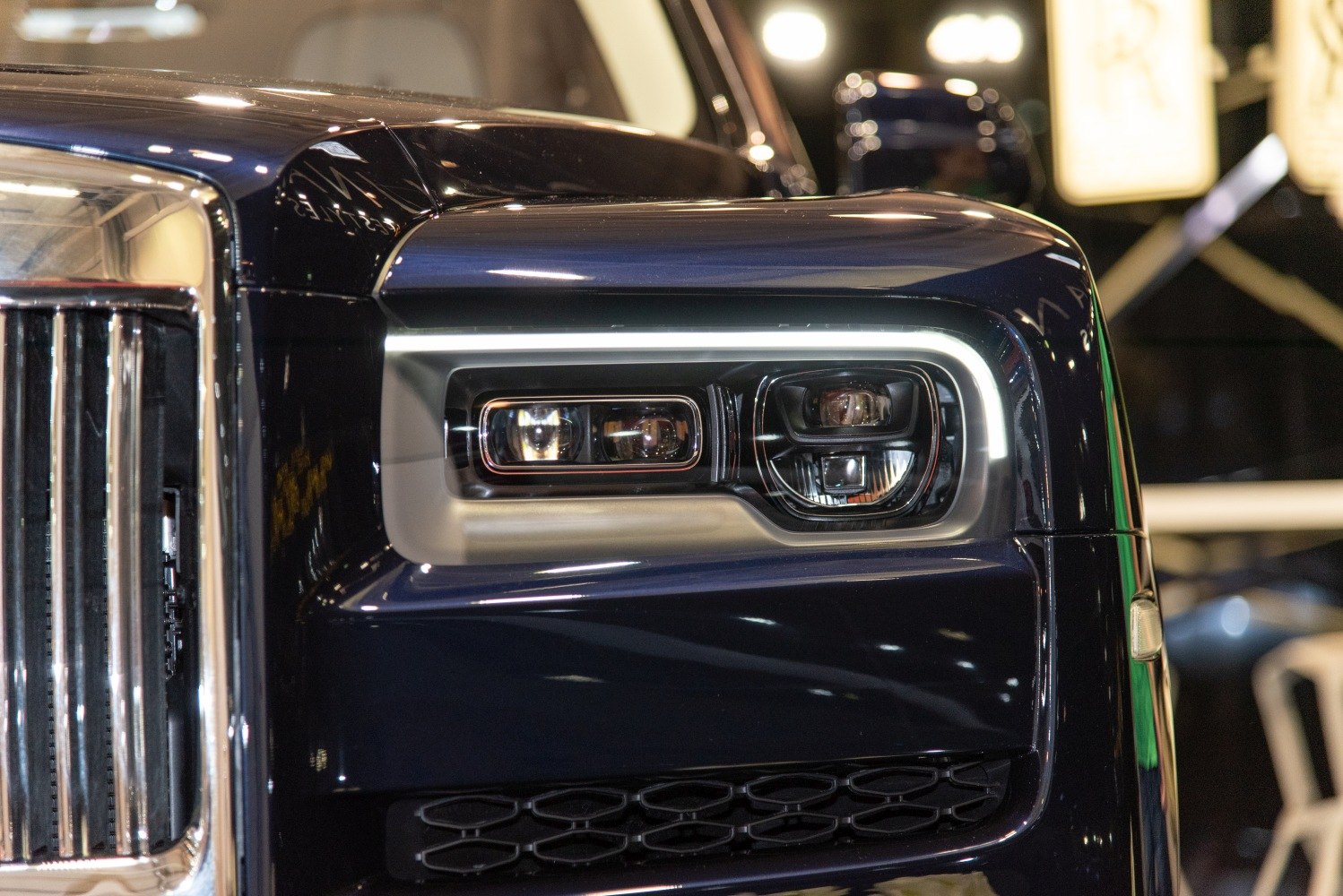 LED headlight with unique shape and chrome front grille