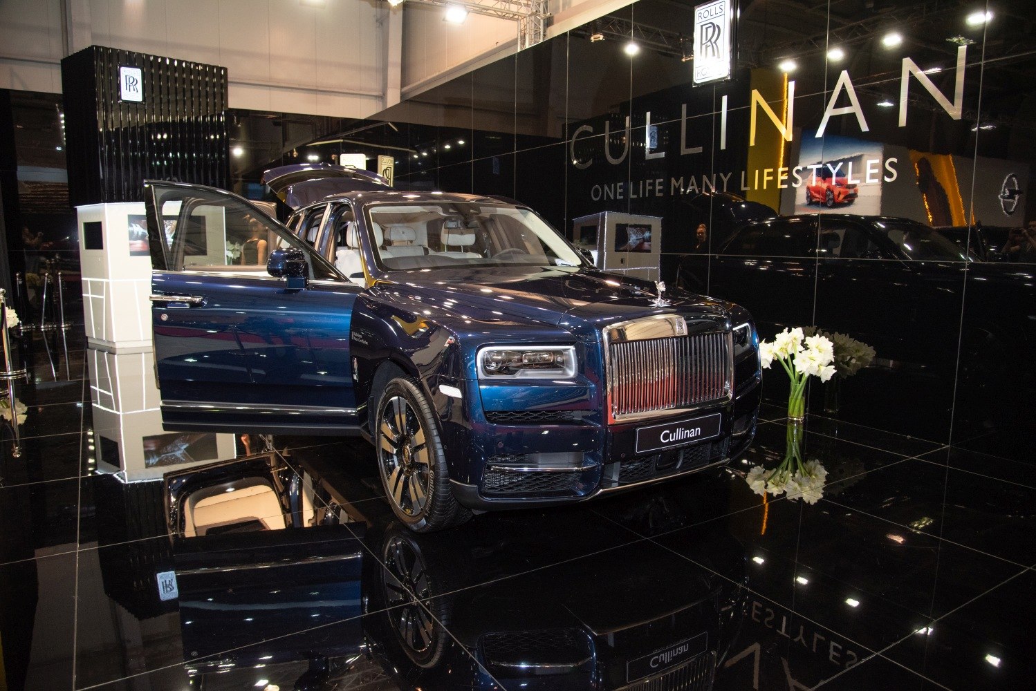 Luxury SUV with signature grille and open door