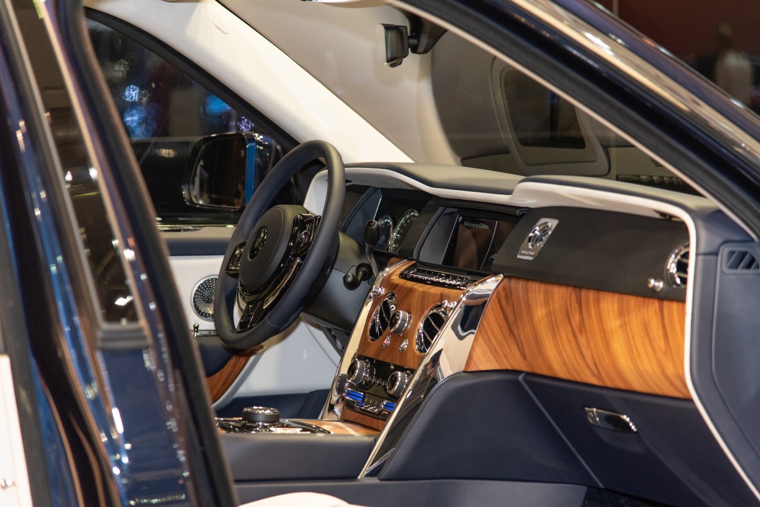 Luxury wooden dashboard and elegant steering wheel in a premium interior