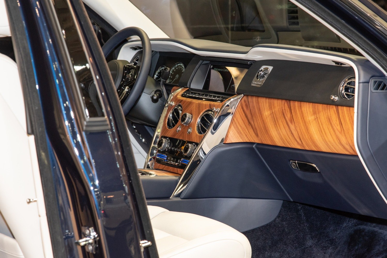 Luxury car interior with wood dashboard and chrome detailing