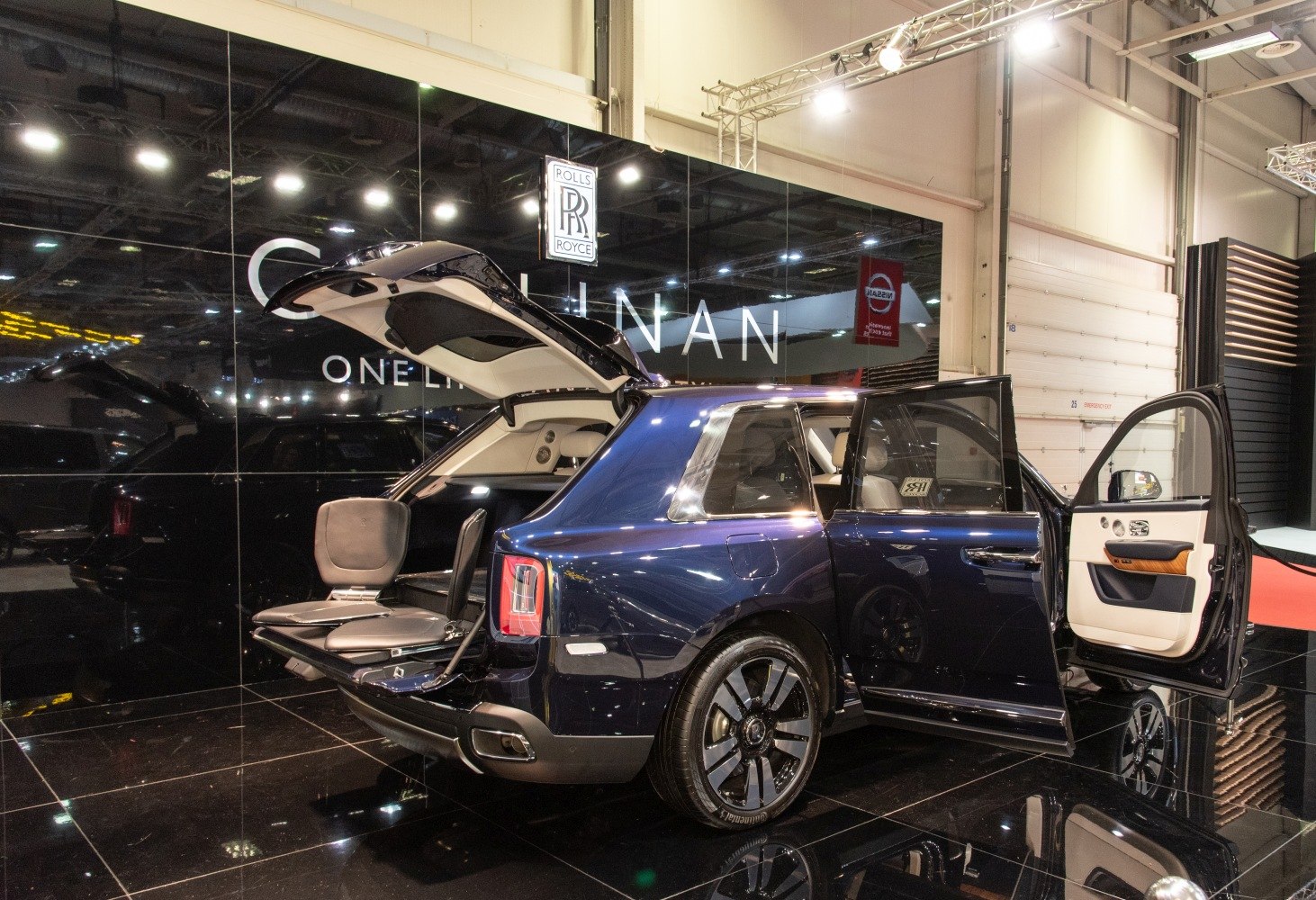 Luxury SUV open rear tailgate and foldable rear seats