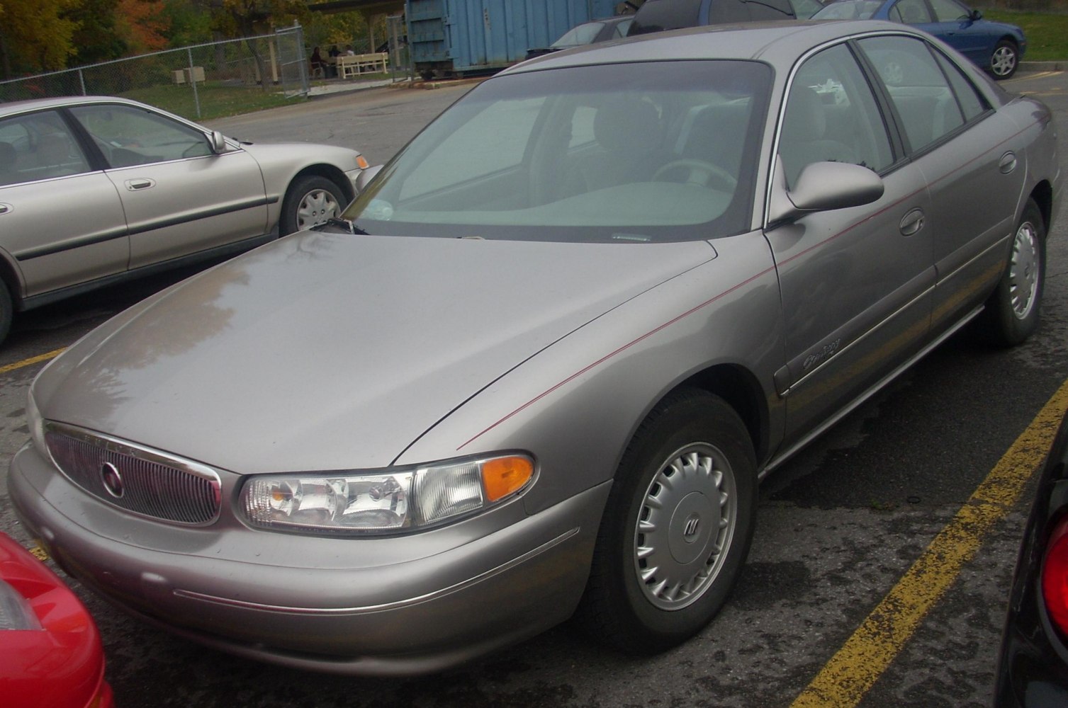 Silver sedan with classic grille and front headlights
