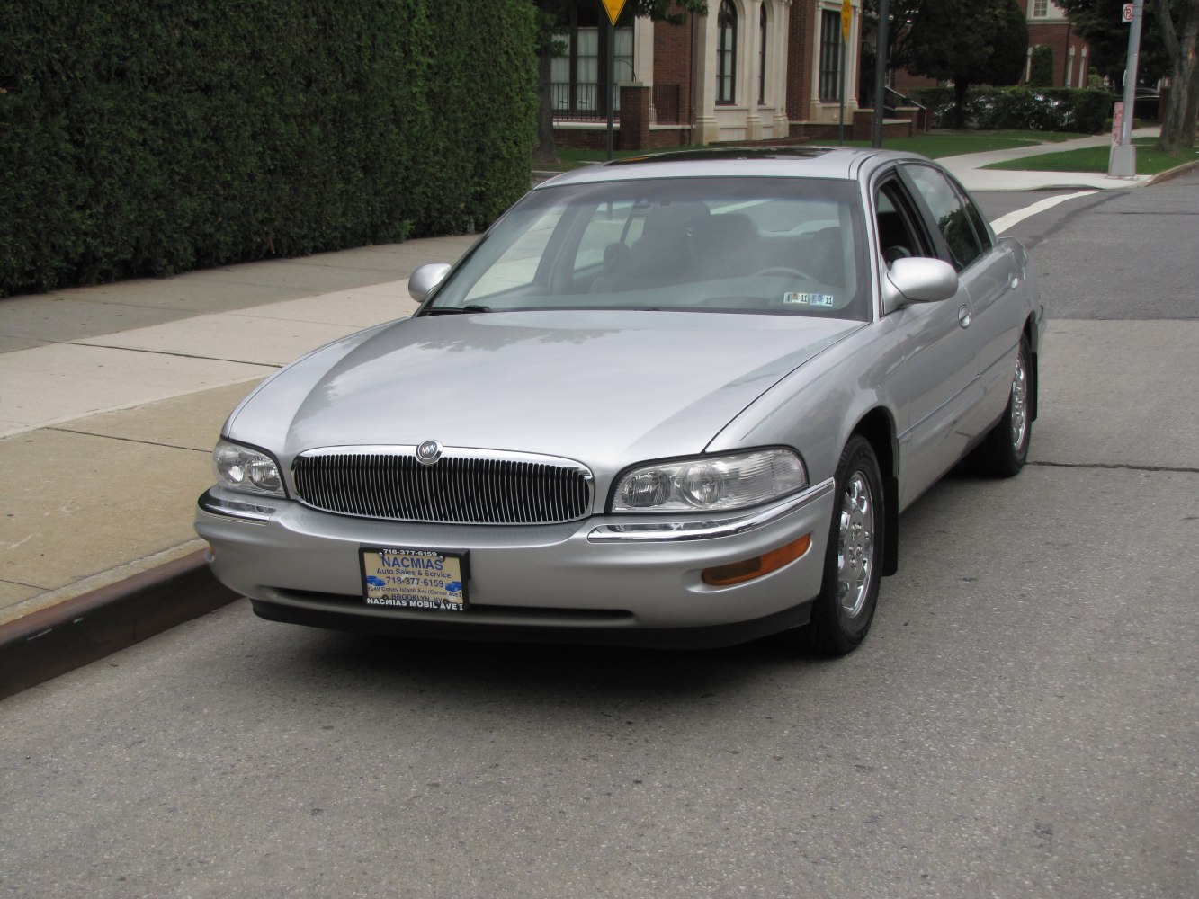 Silver sedan with chrome grille and rounded headlights