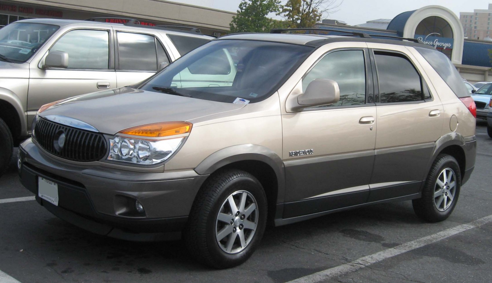 Two-tone SUV with alloy wheels and distinct front grille