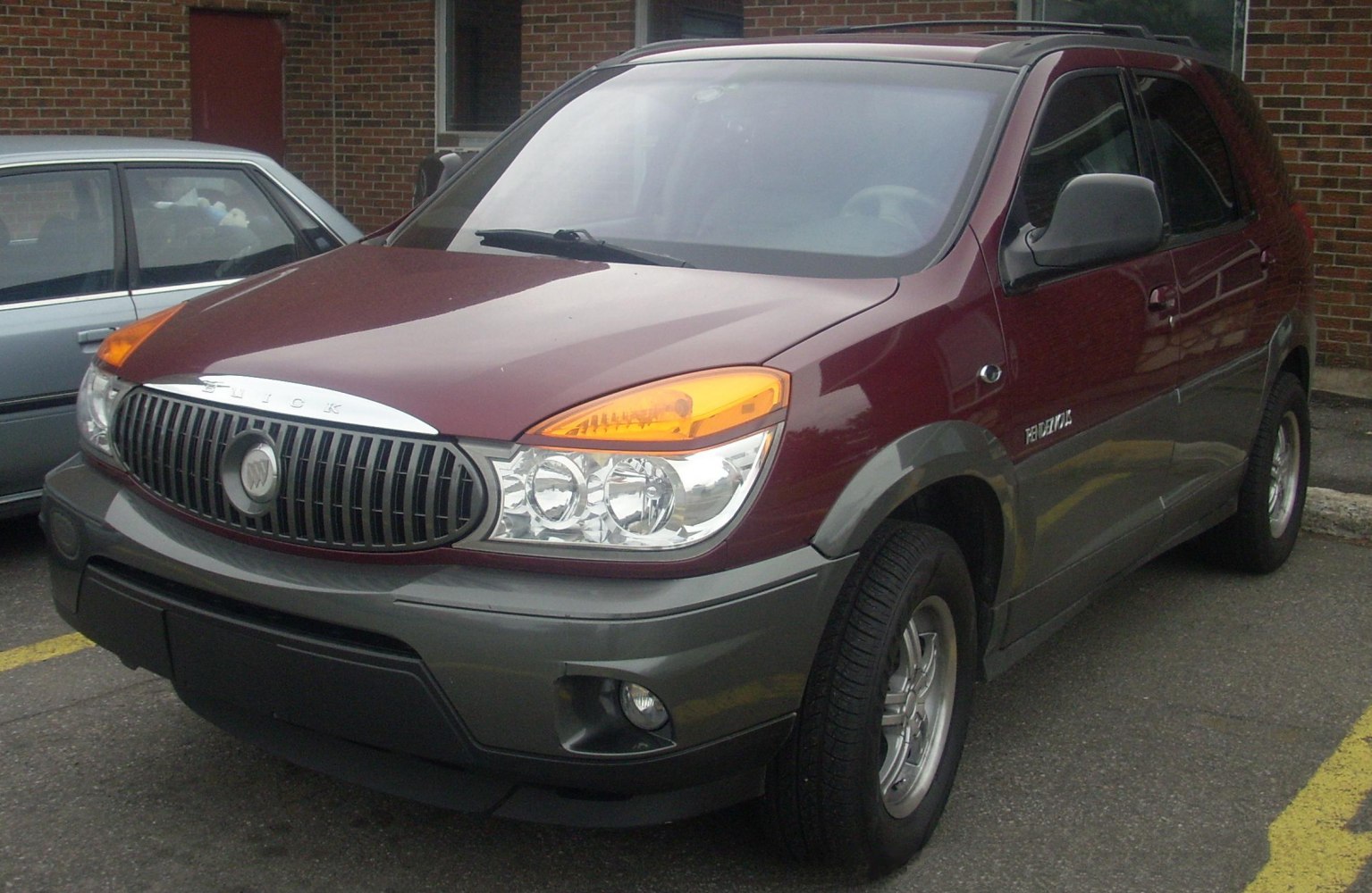 Front view of SUV with distinctive grille and headlights.