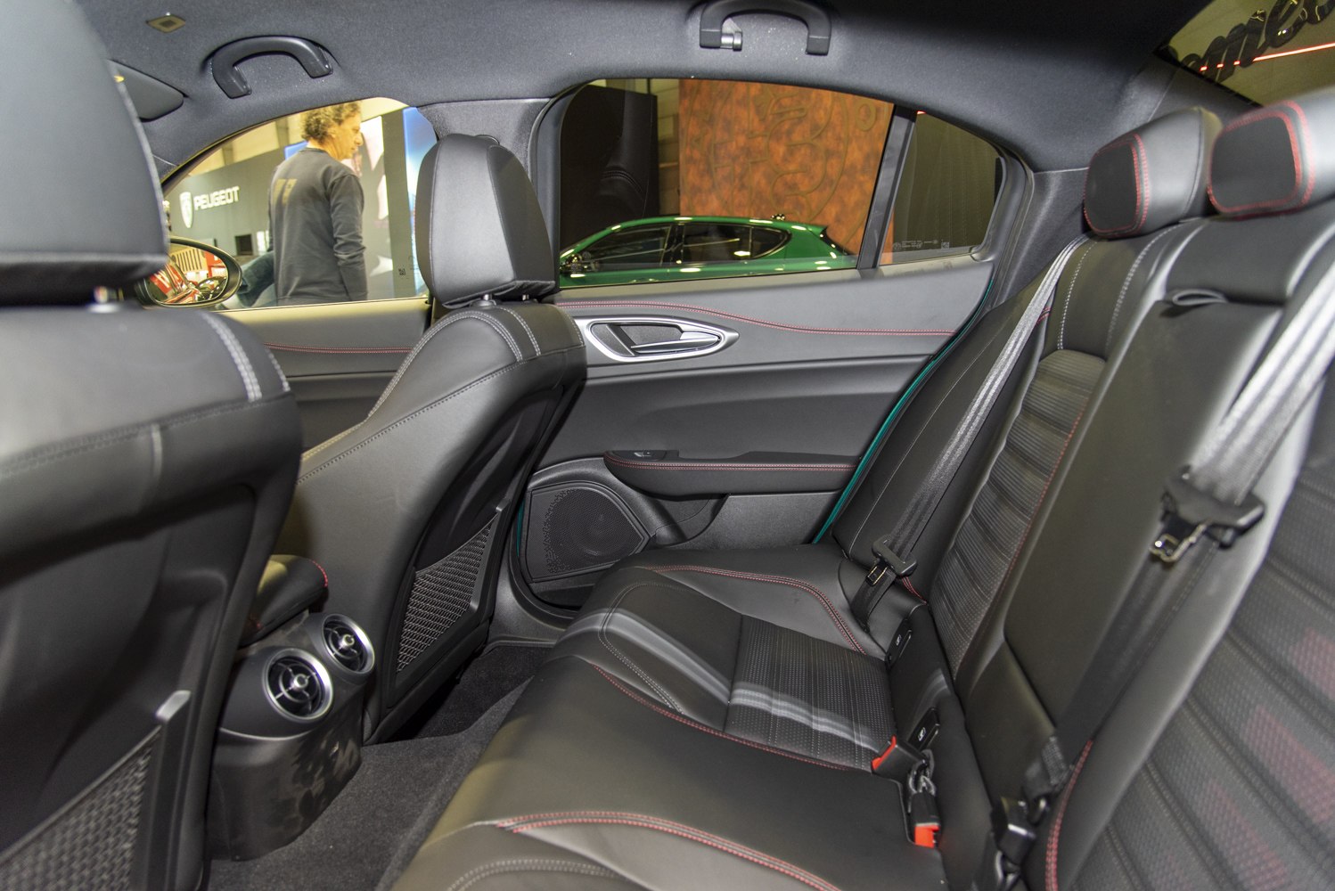 Black leather rear seats with red stitching and rear air vents