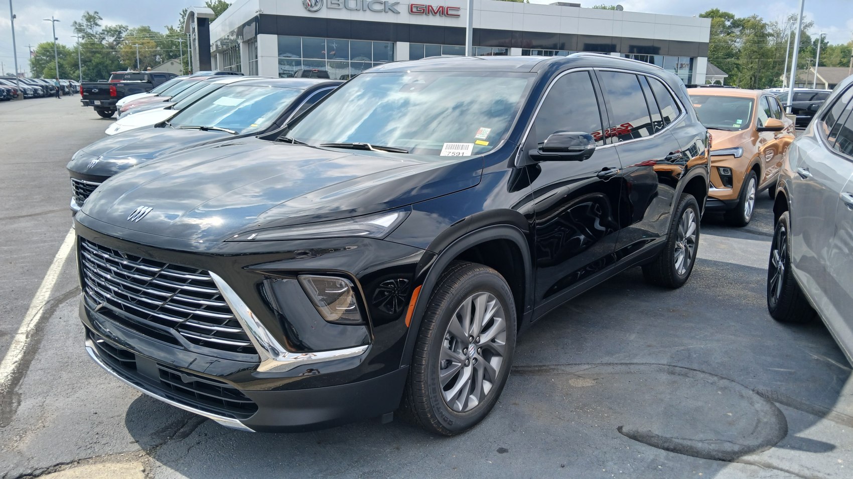 Gloss black SUV with modern front grille and LED headlights