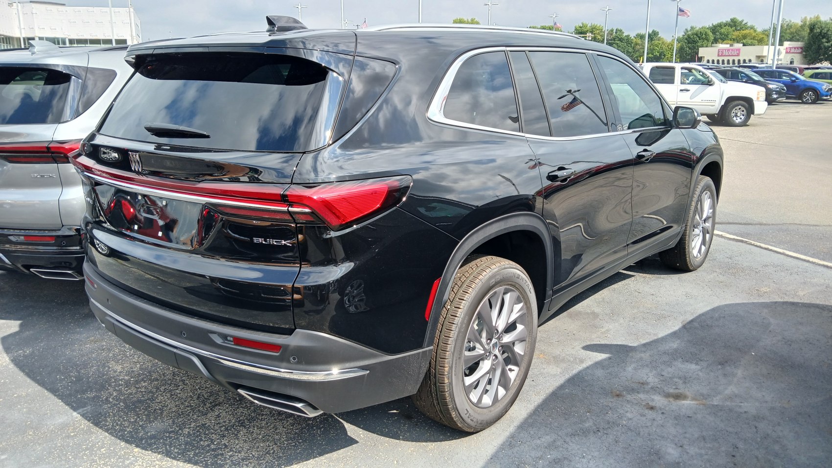 Rear and side view of a black SUV with sleek taillights and tinted windows.