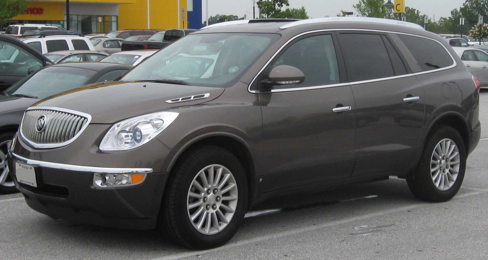 SUV with chrome vertical-slat grille and multi-spoke alloy wheels