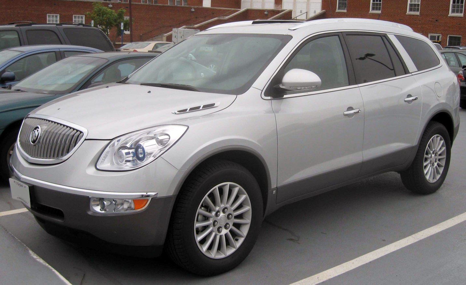 Silver mid-size SUV with prominent front grille and alloy wheels