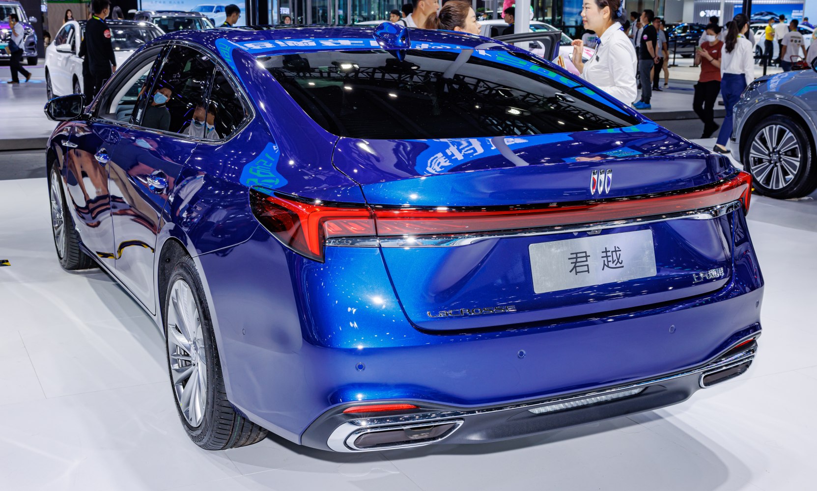 Rear design with sleek LED tail lights and dual exhaust of a modern luxury sedan.