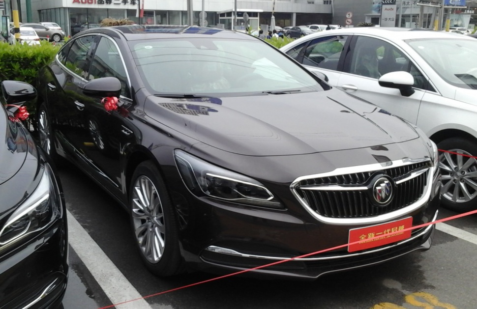 Front grille and LED headlights of a modern luxury sedan.