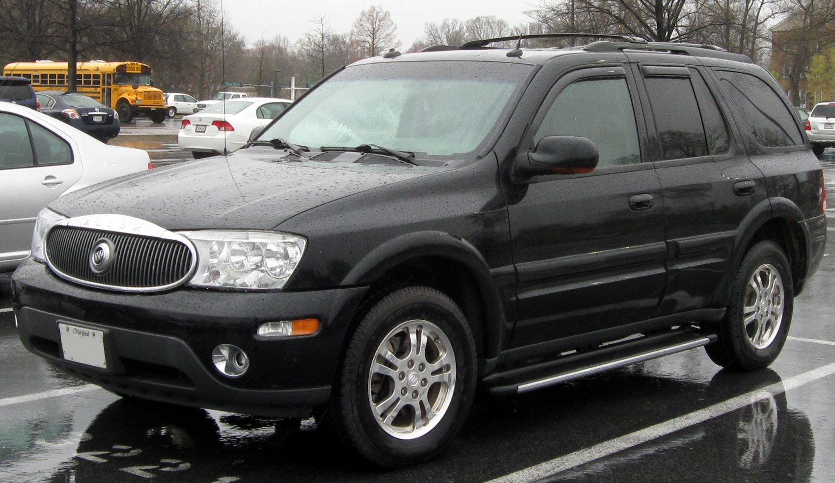 SUV with vertical grille, alloy wheels, and side steps