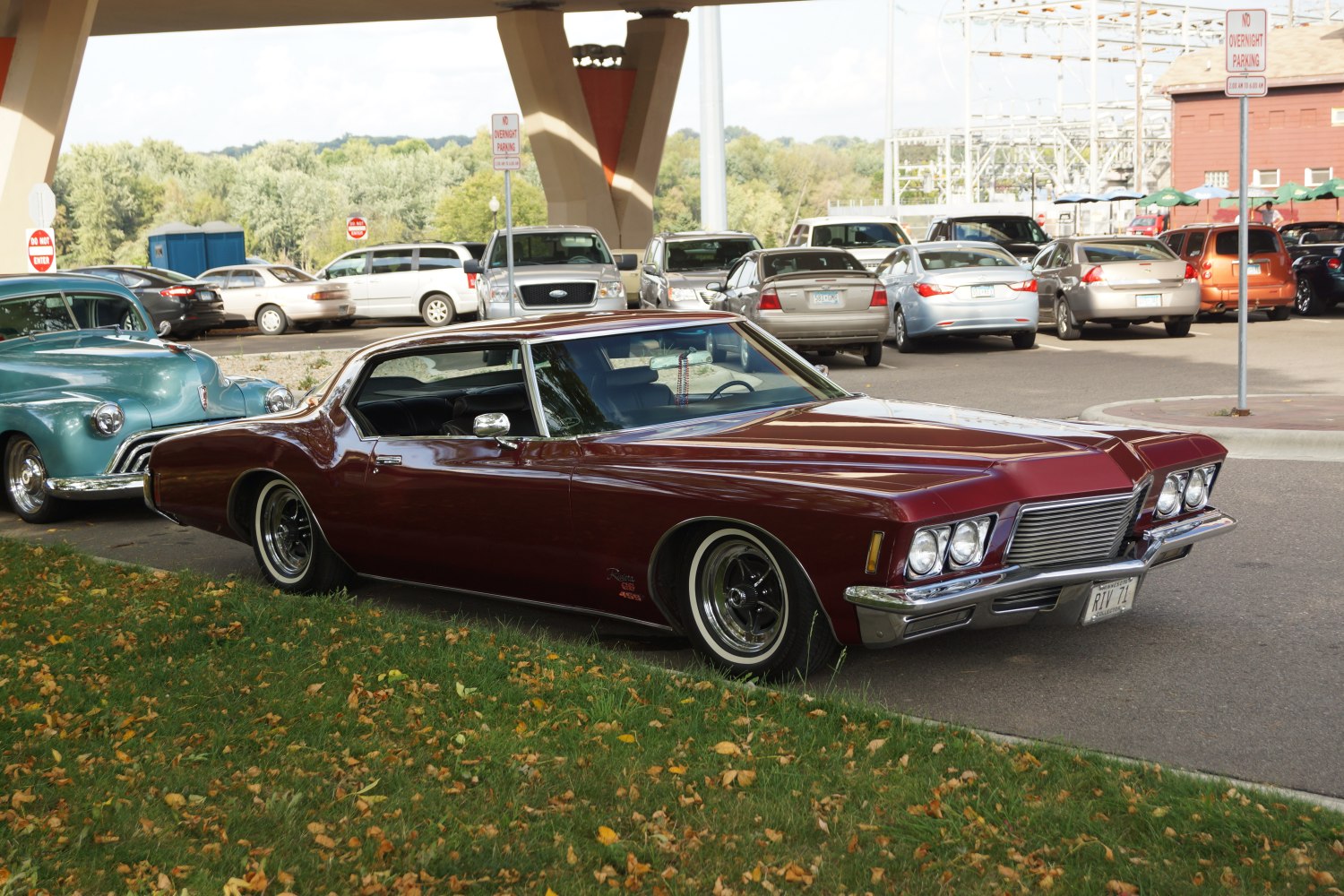 Front-side view of classic coupe with quad headlights and long hood