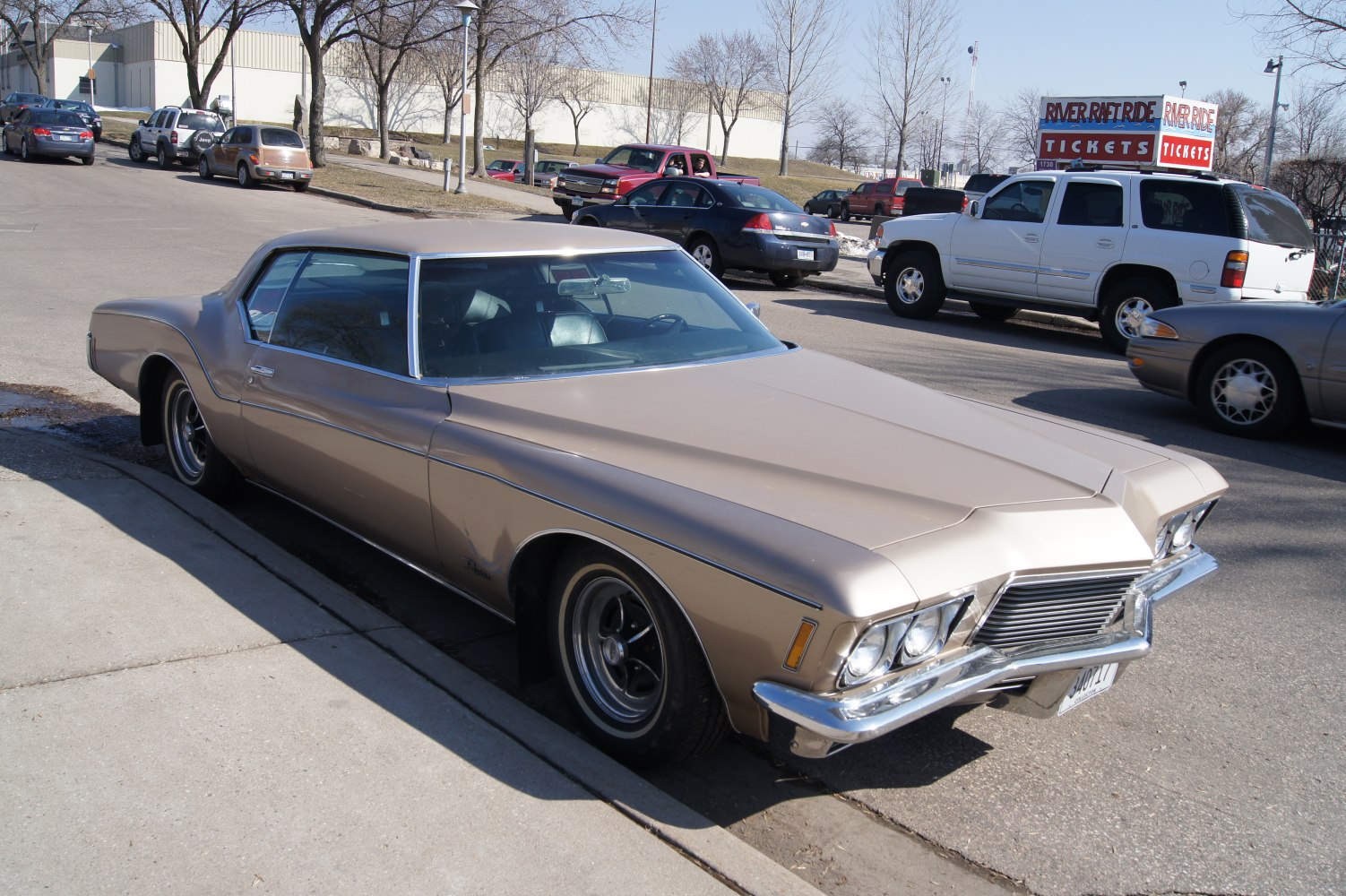 Vintage car with long hood, chrome bumper, sharp body lines
