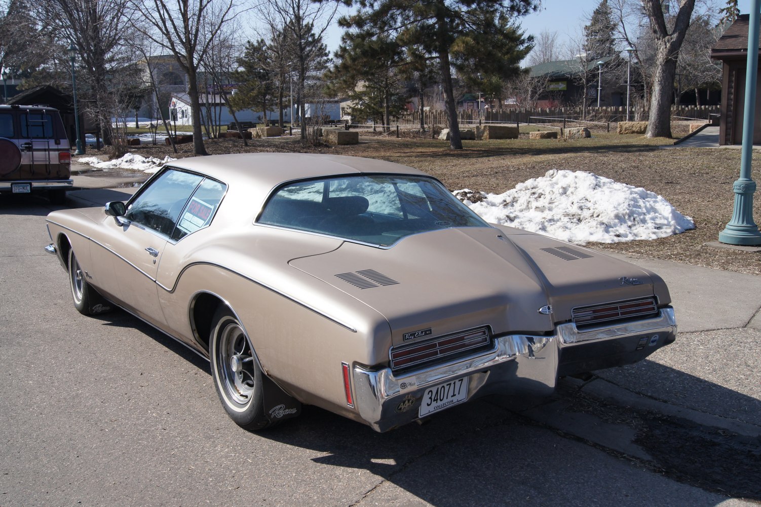 Rear view of vintage coupe with split trunk design and classic taillights