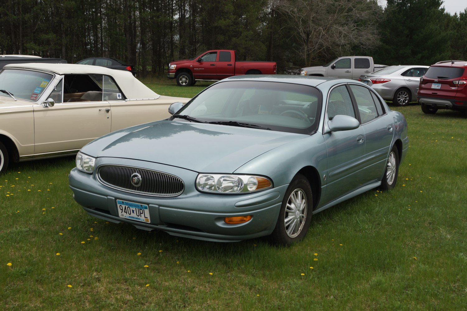Front side view with distinct grille and headlights
