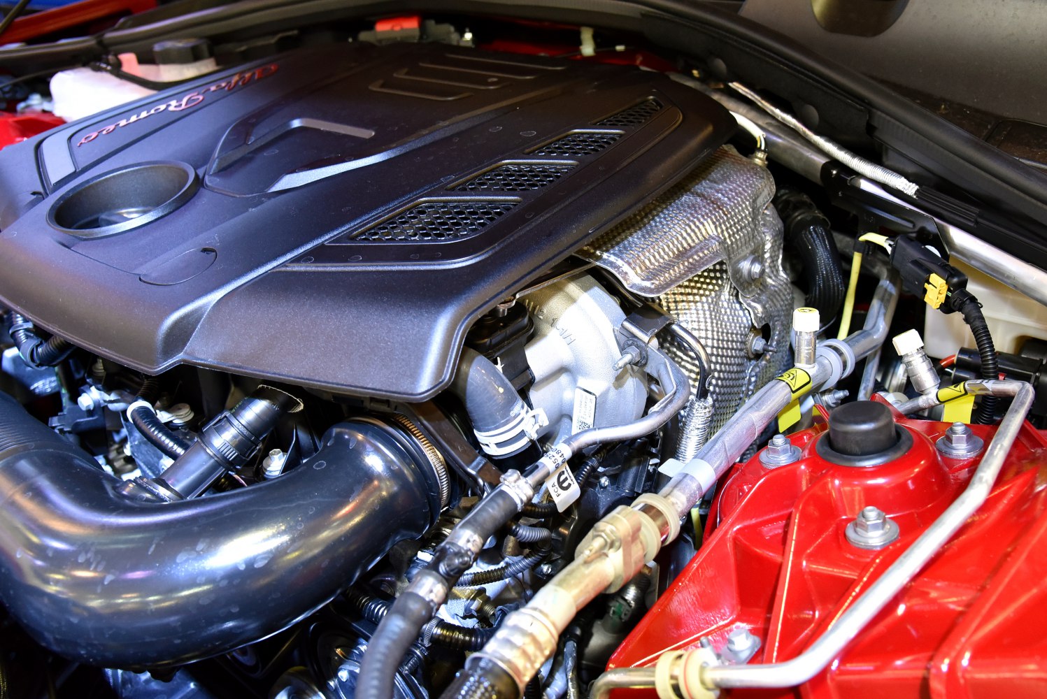 Close-up of engine compartment with engine cover and turbocharger