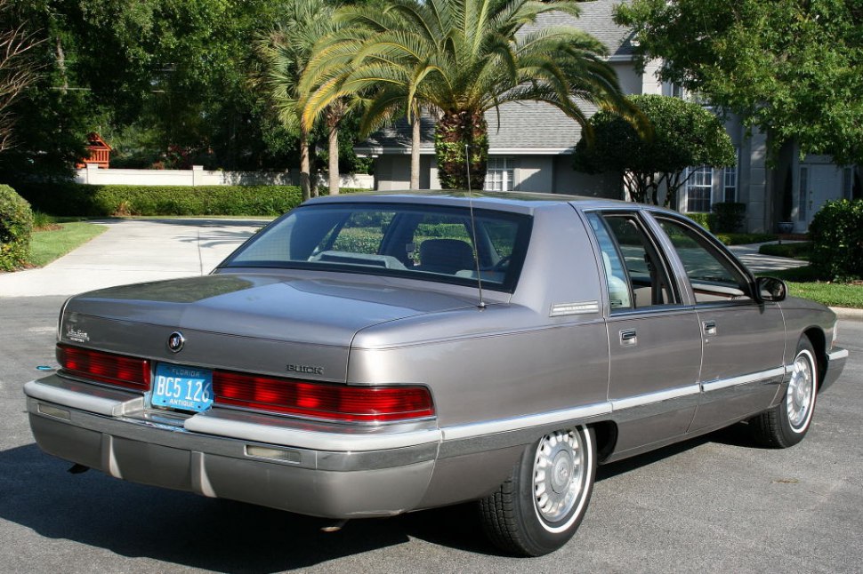 Rear view of classic full-size sedan with wide taillight and chrome trim