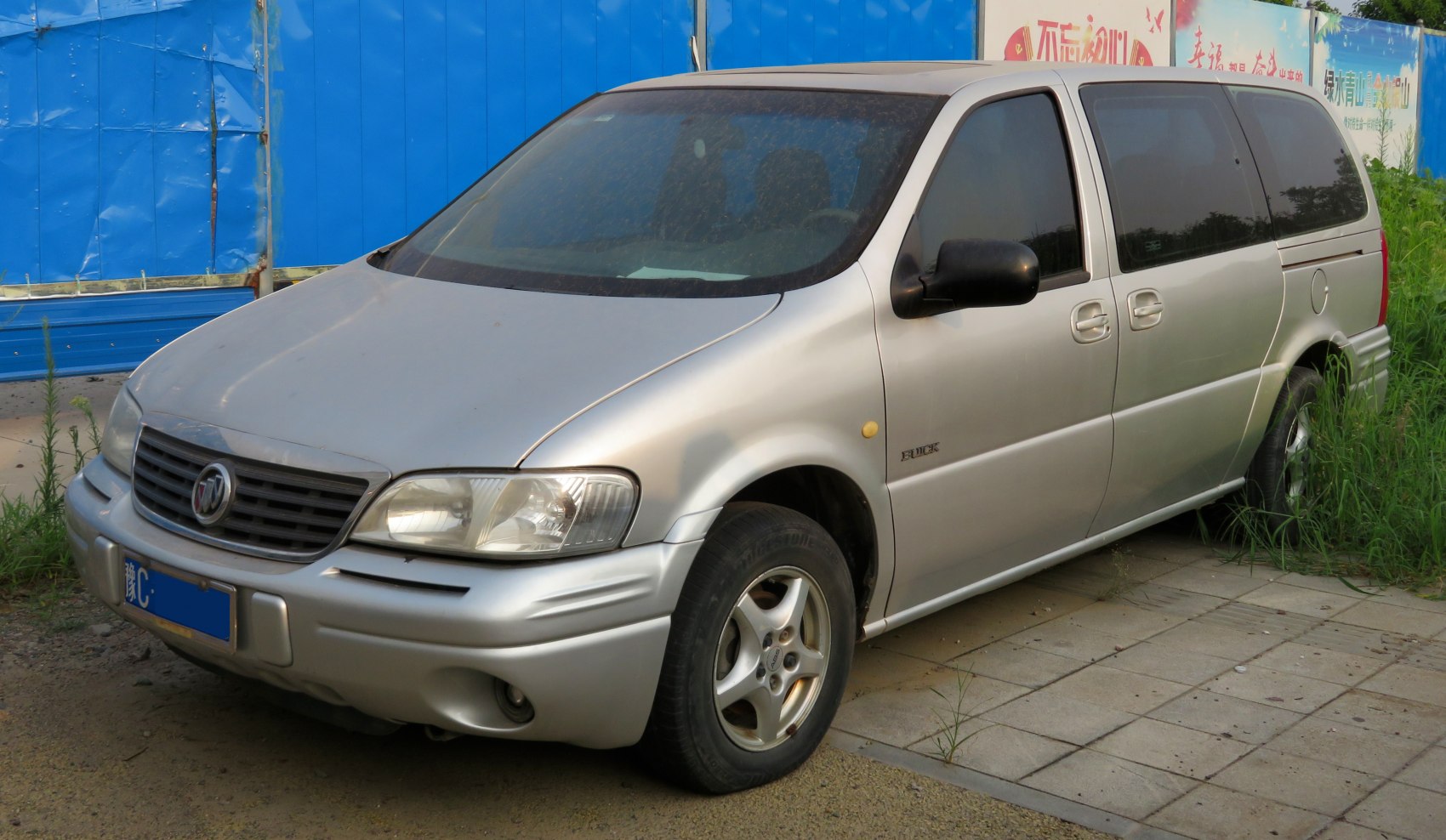 silver minivan, front and side view, sliding doors