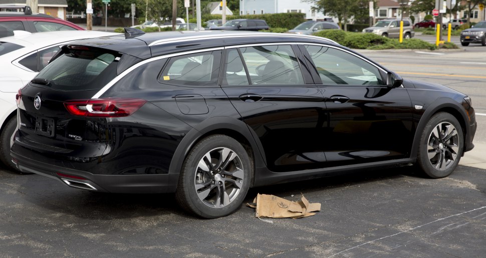 Side and rear view of a black station wagon with alloy wheels