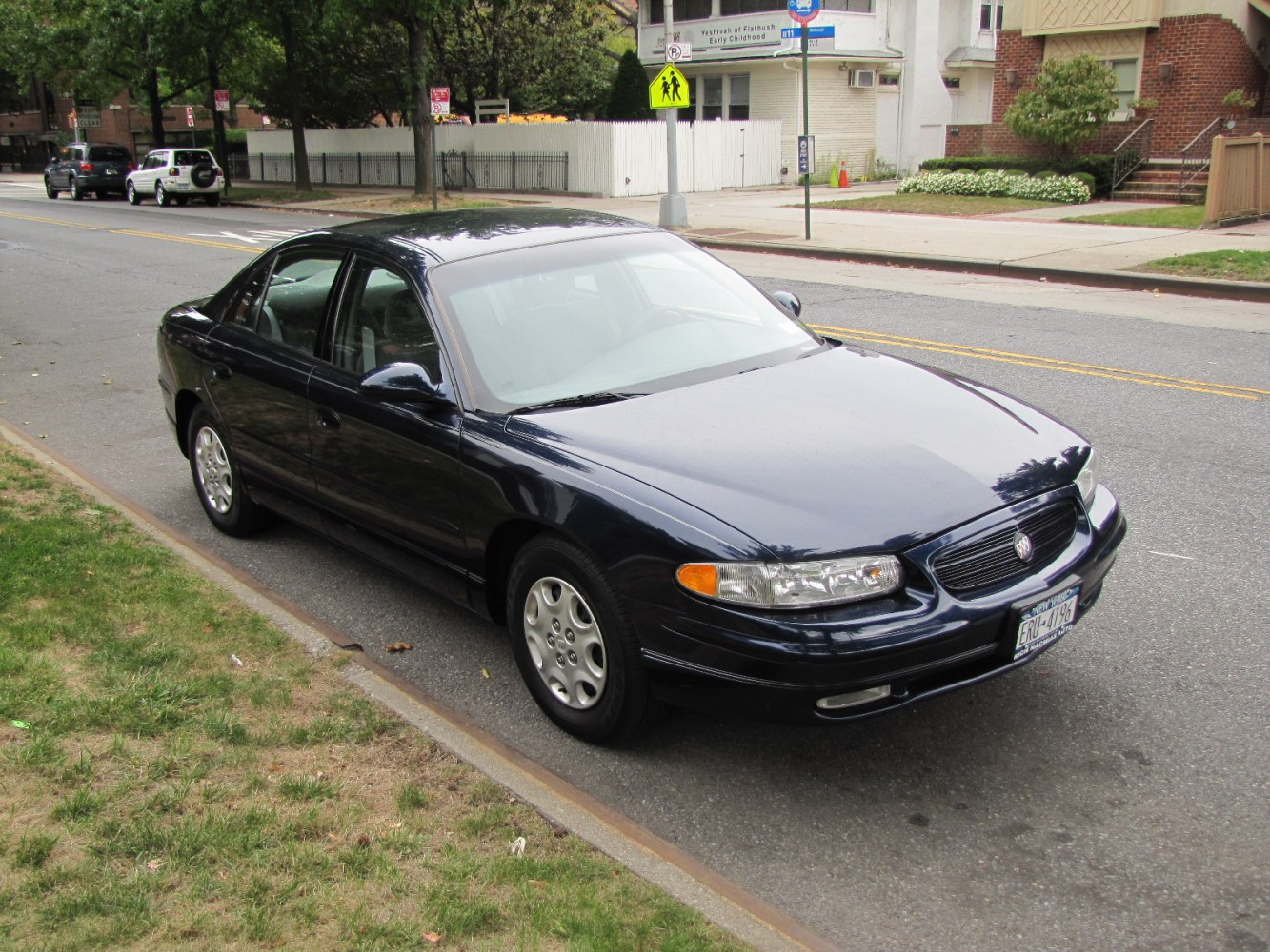Front angle view of a mid-size sedan with smooth curves and distinctive headlamps