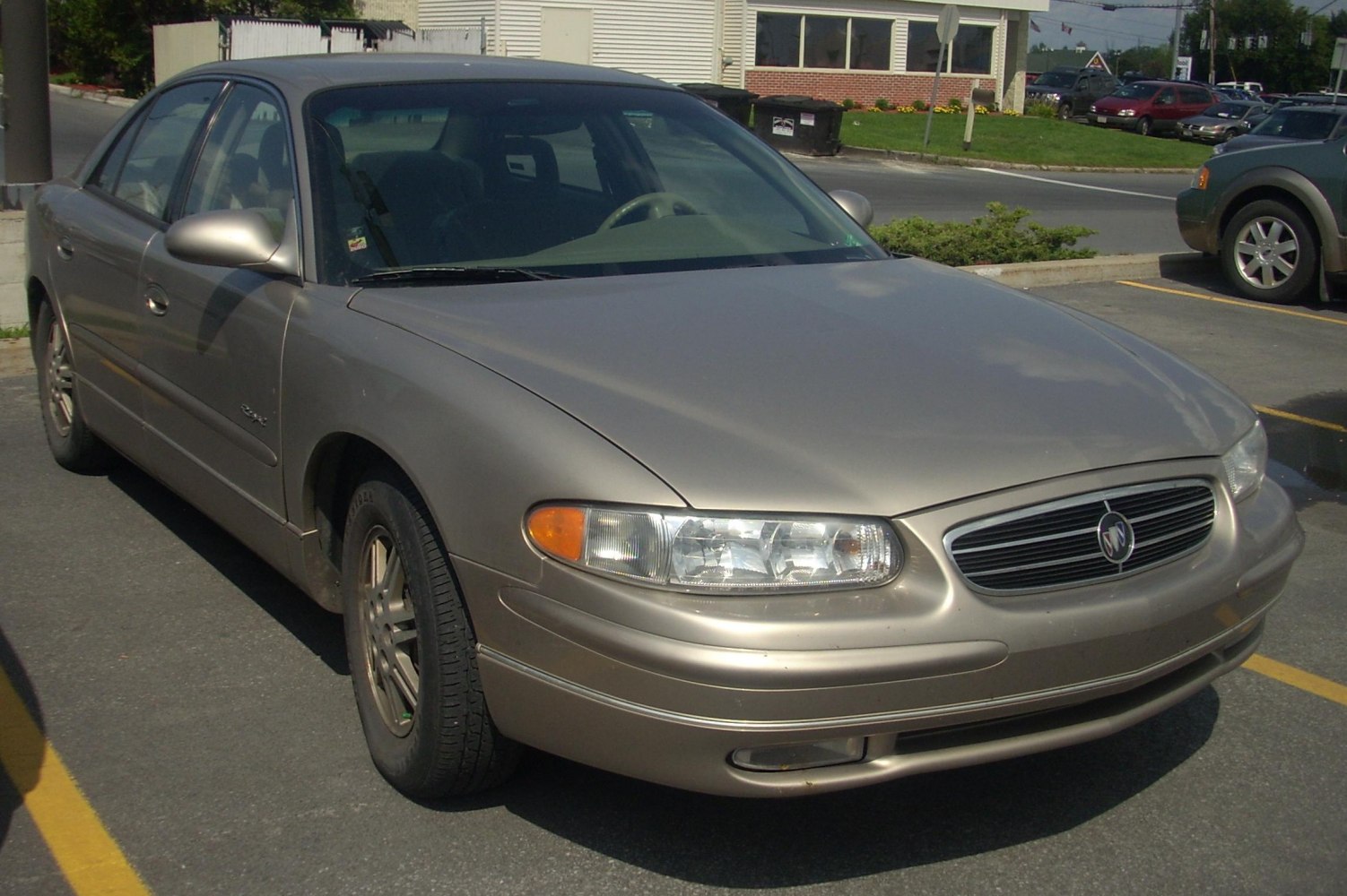 Front and side view of a mid-size sedan with aerodynamic design and integrated headlights.
