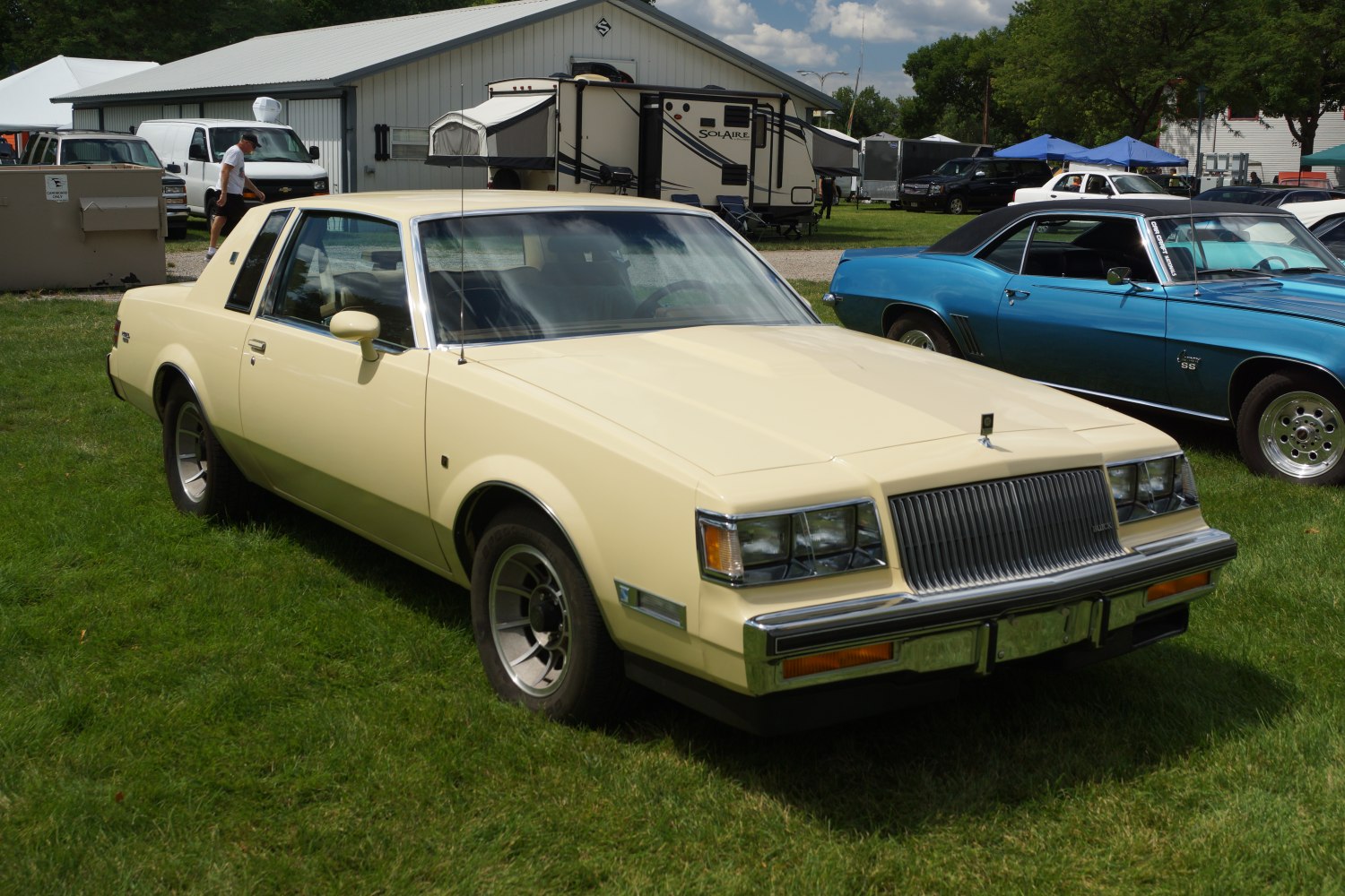 Two-door classic coupe with rectangular headlights and vertical grille
