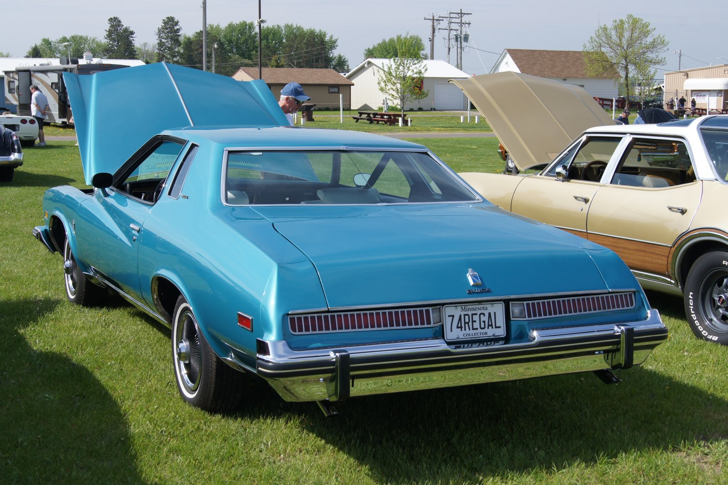 Classic coupe rear view with horizontal tail lights and chrome bumper