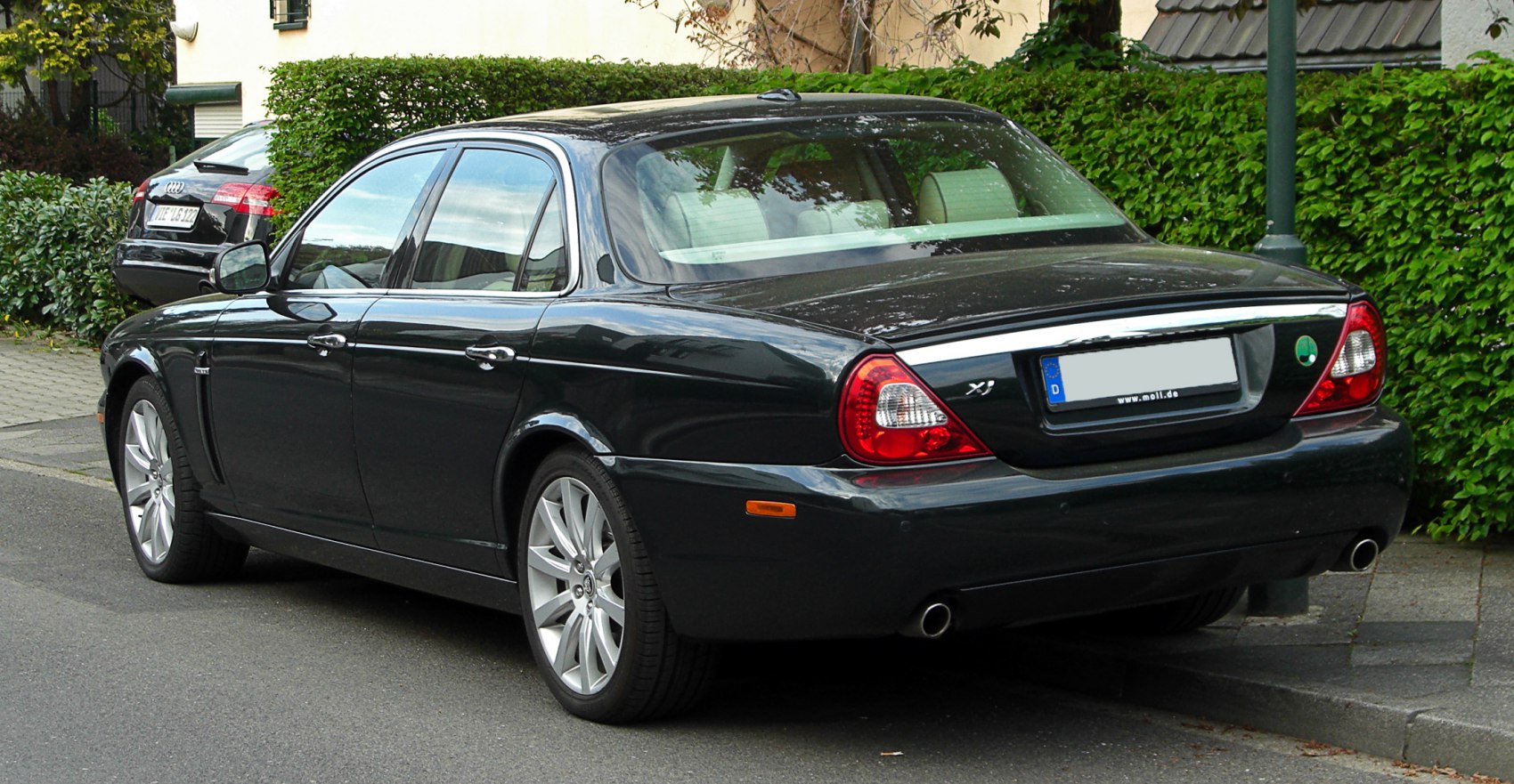 Rear view with distinctive taillights and dual exhaust pipes