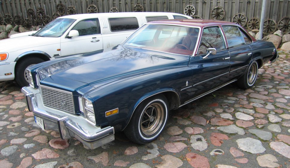 Vintage large sedan with chrome bumper and vinyl roof