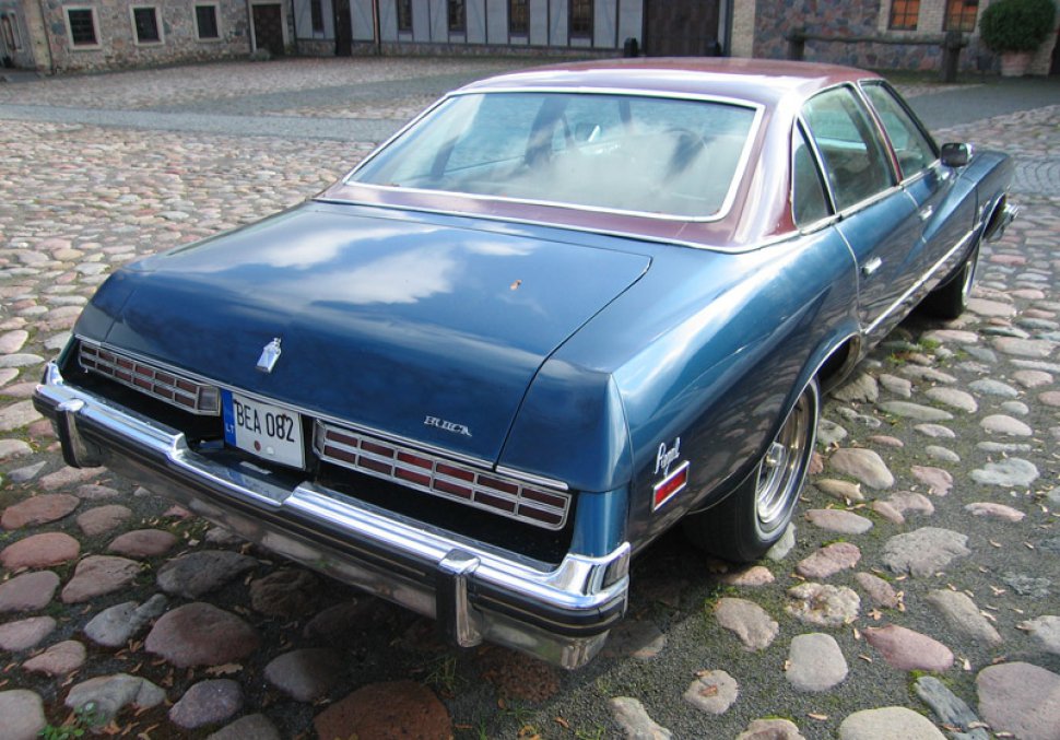 Rear view of vintage sedan with chrome bumper and retro taillights