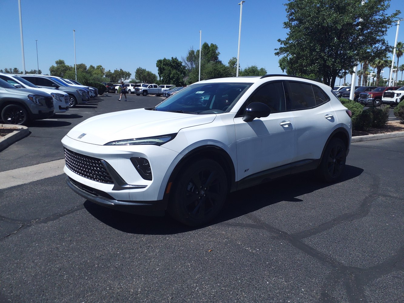 White SUV with large front grille and slim LED headlights