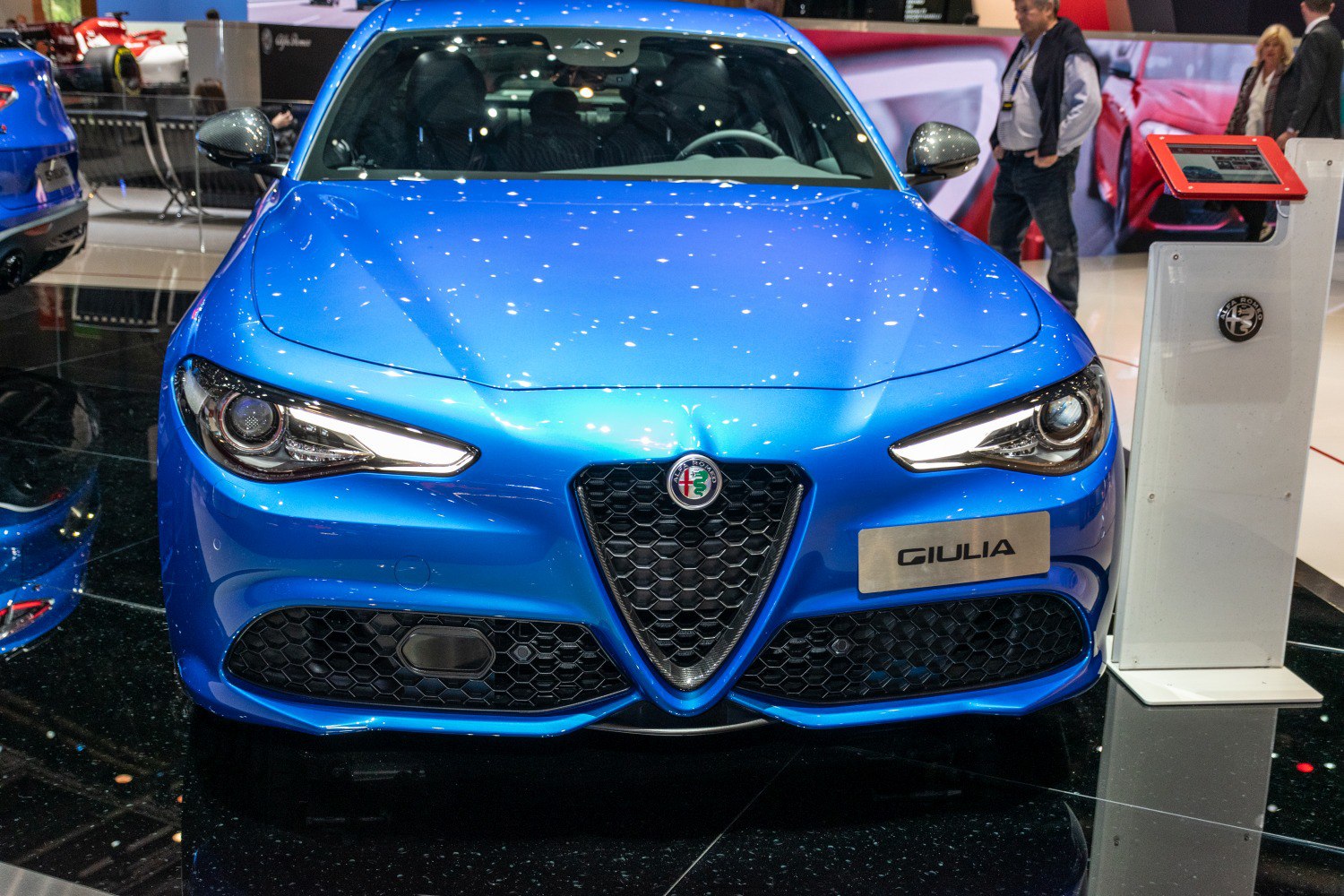 Front view with iconic triangular grille and sharp headlights