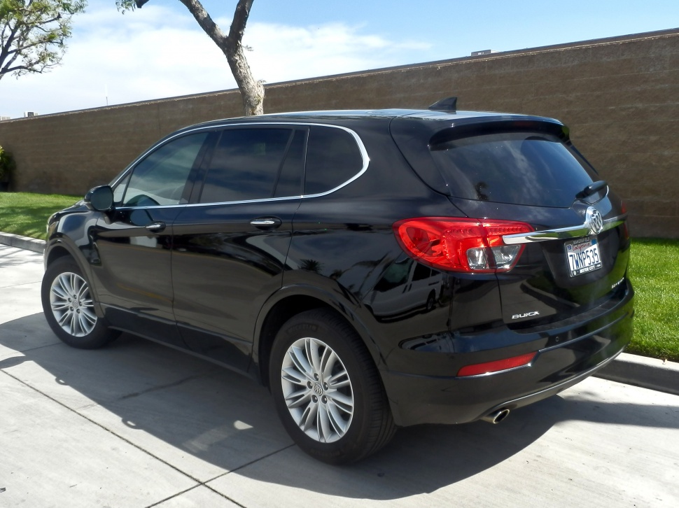 Rear side view with tinted windows and alloy wheels
