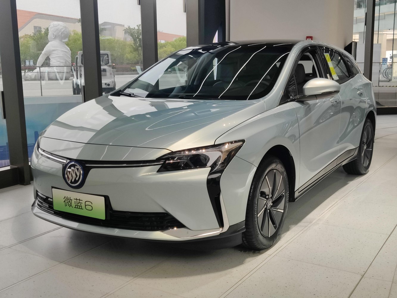 Electric hatchback with sleek front and side profile, LED headlights