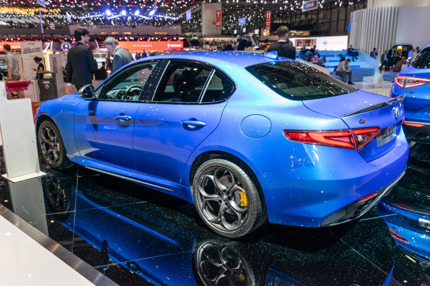 Sporty sedan rear-side view with unique taillights and five-spoke alloy wheels