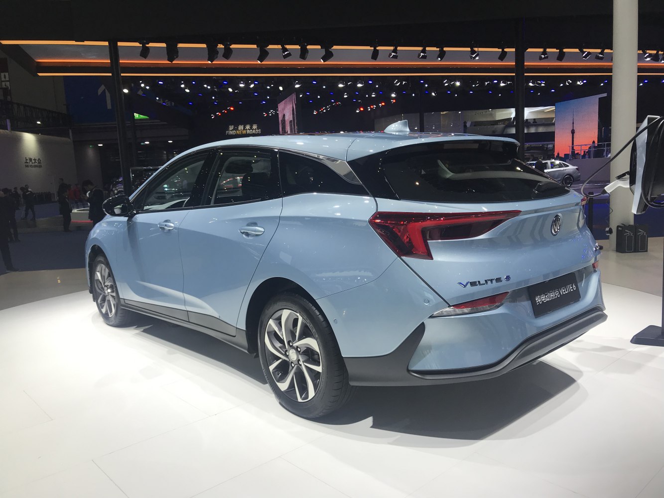 Rear and side profile of an electric hatchback with sleek aerodynamic design and LED taillights.