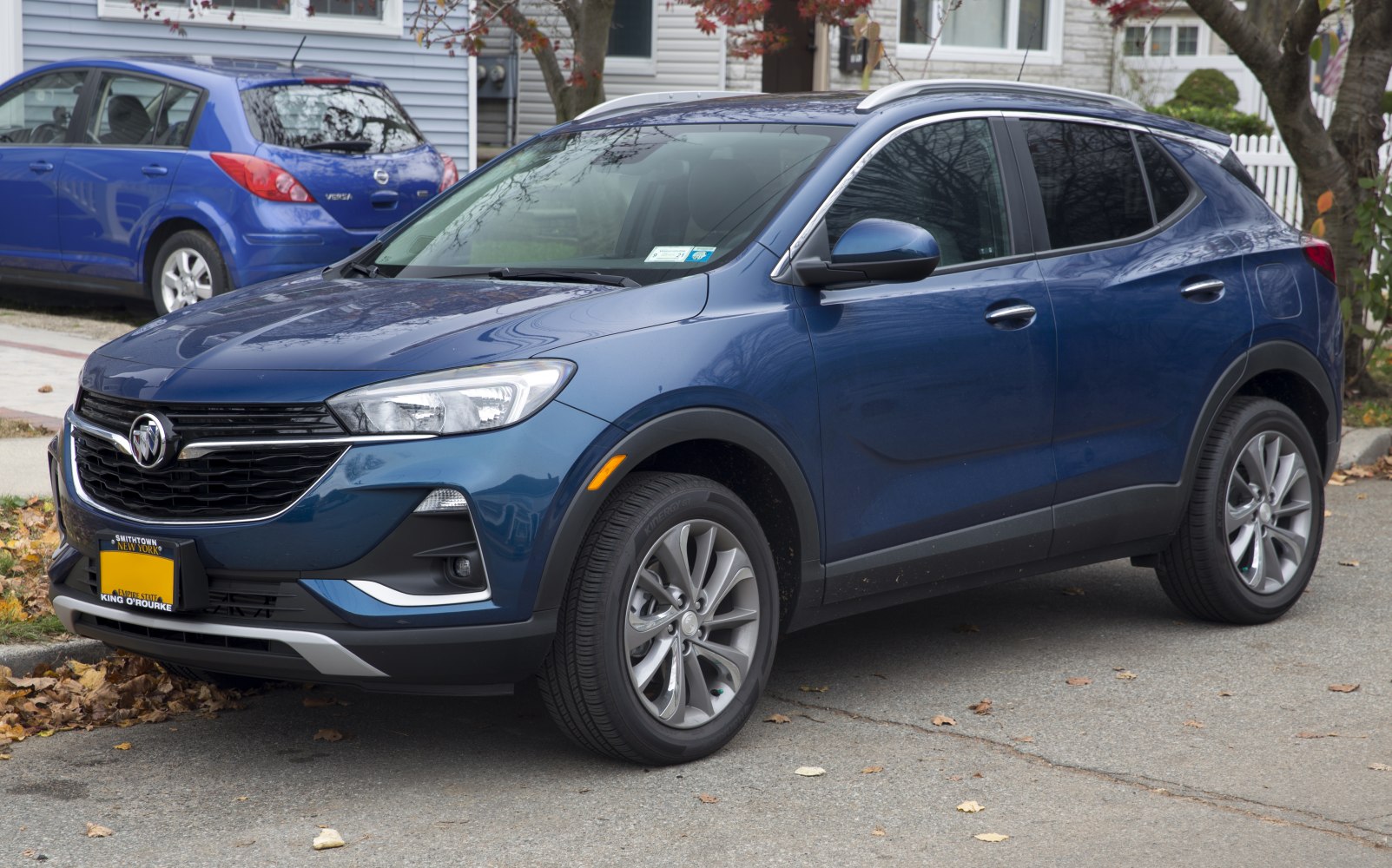 Front-side view of a compact SUV with prominent grille and headlight